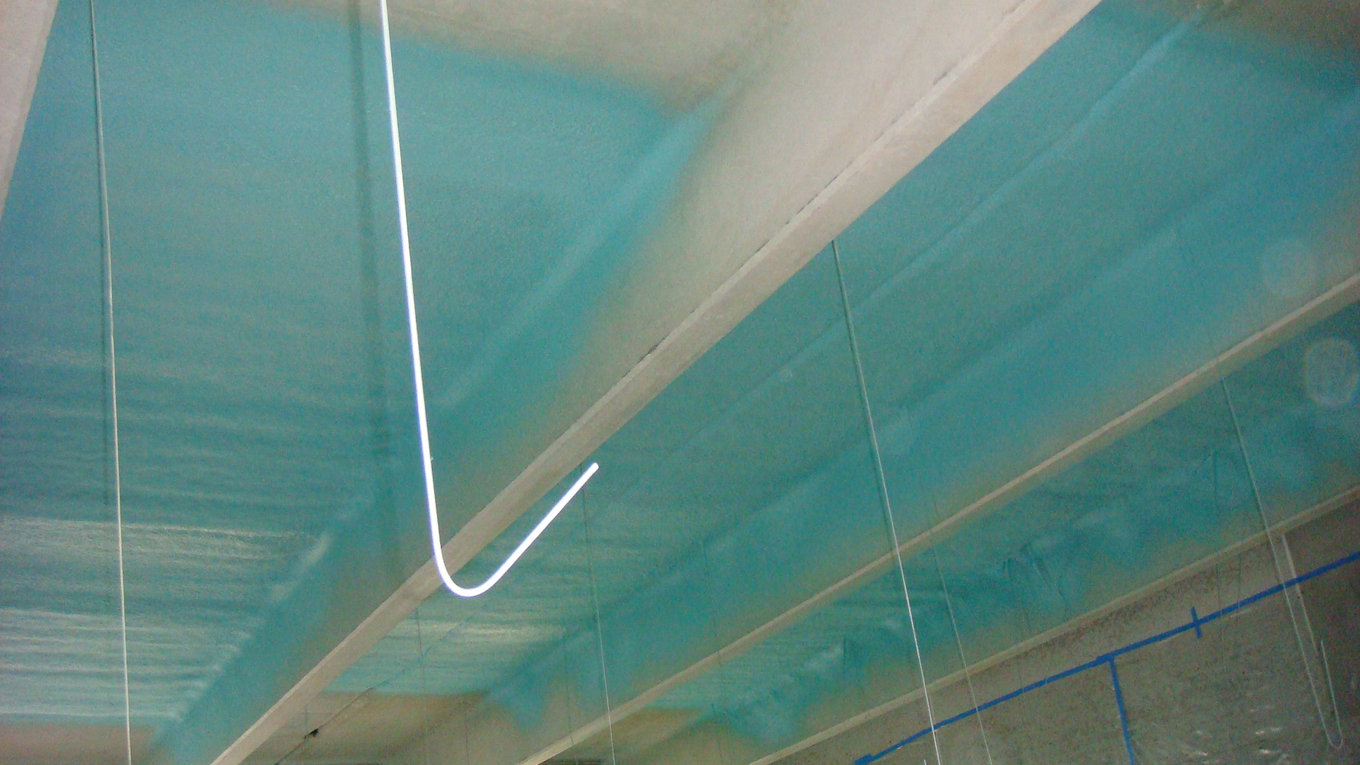 Sprayed protective coating on industrial equipment