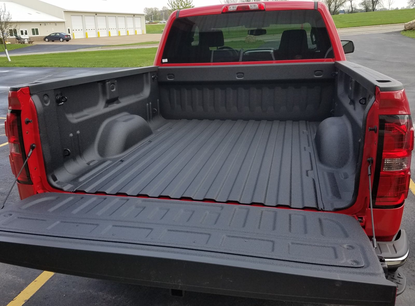 Work truck with sprayed polyurea corrosion protection