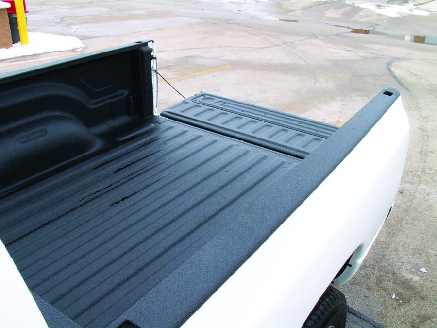 Finished sprayed polyurea liner covering bed seams and bolt heads